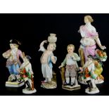 A collection of Meissen and Dresden figures, to include a figure with a dragon, a candlestick, a