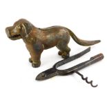 A cast iron nutcracker, modelled in the form of a dog, a set of clippers with cork screw attachment,