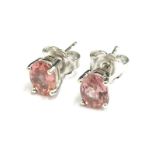 A pair of pink tourmaline earrings, each in basket setting, with butterfly backs, 3g all in.