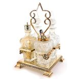 An Edwardian silver plated and cut glass four bottle cruet, with two glass bottles and stopper, a