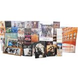 A collection of music and film related items, to include six large boards, each mounted with album