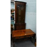 A drop leaf mahogany coffee table in Regency style, 95cm wide, flaps down and a standing mahogany