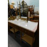 A mahogany pine and glass rectangular dressing table, with fabric top and a gilt triple mirror. (2)