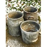 Two similar moulded garden pots, each made to simulate milk churns, 46cm high, and a milk pail, with