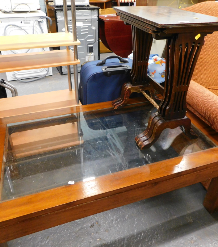 A nest of three mahogany tables, and a hardwood glass coffee table.