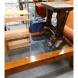 A nest of three mahogany tables, and a hardwood glass coffee table.