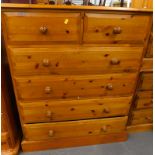 A pine chest of two short and four long drawers, 111cm high, 89cm wide.