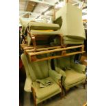 A collection of five green upholstered Parker Knoll wingback chairs, three on cabriole, two with