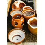 A quantity of terracotta pots, to include a nativity scene example.