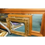 A quantity of wall mirrors, to include various pine framed mirrors, gilt framed examples, etc. (a