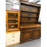 A pine HIFI cabinet, a modern chest of three drawers, and an oak dresser.