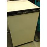 A Hotpoint beige upright freezer.