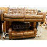 A large three seat brown leather sofa, 214cm wide, and a smaller brown two seat sofa.