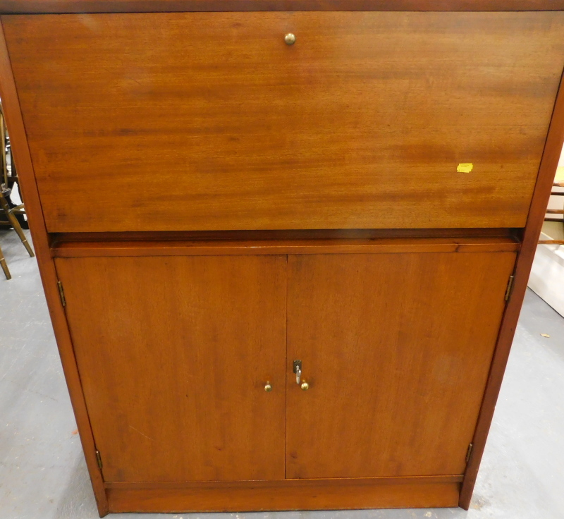 A Herbert E Gibbs Autograph retro teak bureau, label to reverse number 4769 910, with a fall front