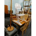 A pine kitchen table, three chairs, standard lamp, child's high chair, coffee table, bamboo table,