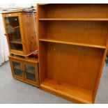 A pine HIFI cabinet, an oak veneered TV cabinet and a teak bookcase, walking sticks, oval coffee