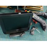 A Hitachi 15" television, with lead and remote, two pairs of ladies boots, with shoe trees.