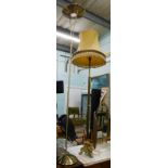 A continental brass standard lamp, and a modern brass uplighter. (2)