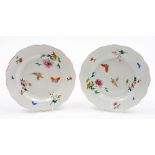 A pair of 18thC Chinese porcelain plates, each decorated in polychrome enamels with butterflies