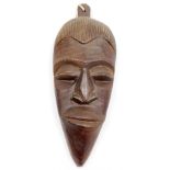 Tribal Art. A late 20thC mahogany wall mask, depicting a gentleman 39cm high, 16cm wide.