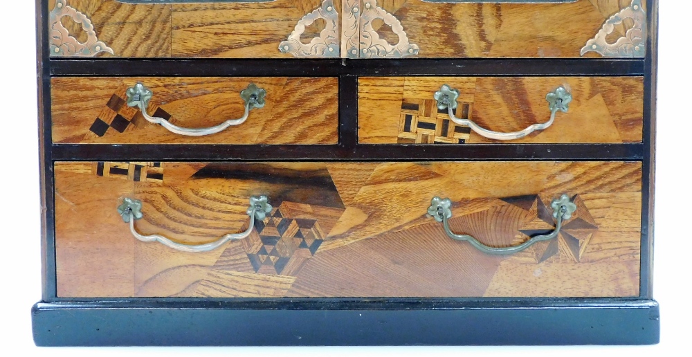 A Japanese Meiji period parquetry and lacquer table cabinet, with two doors opening to reveal six - Image 4 of 7