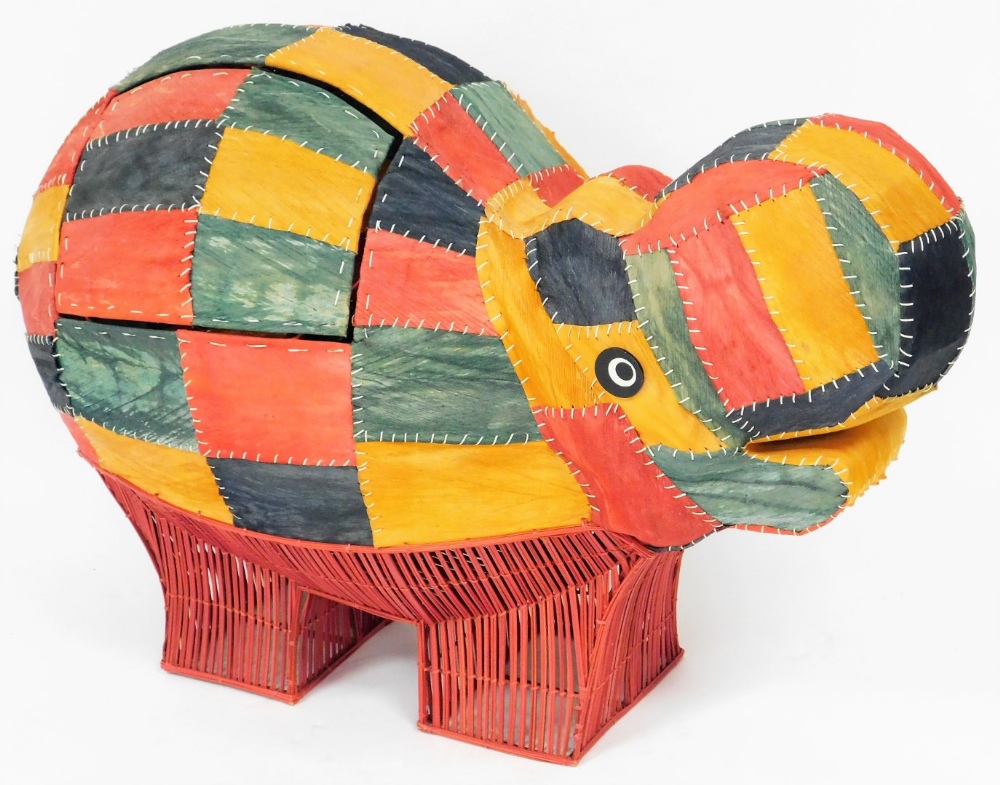 A multi coloured hide, wicker and metal framed hippo storage box, 79cm high, 106cm wide, 37cm deep