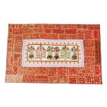 A large tapestry wall hanging, with central reserve of stylized elephants and trees within a