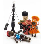 A group of tribal figures and ornaments, to include a tribal art carved novelty figure, two