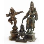 An Indian Hindu bronze figure of Krishna, modelled standing on one leg holding a ball of butter, 8.