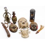 A group of tribal art, comprising a metal face mask, with elaborate head dress set with exotic