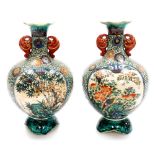 A pair Japanese Kutani pottery bulbous vases with compressed trumpet necks, decorated with panels of