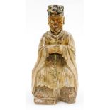 A Chinese painted wood figure, of a seated sage in flowing robes with polychrome hat, probably