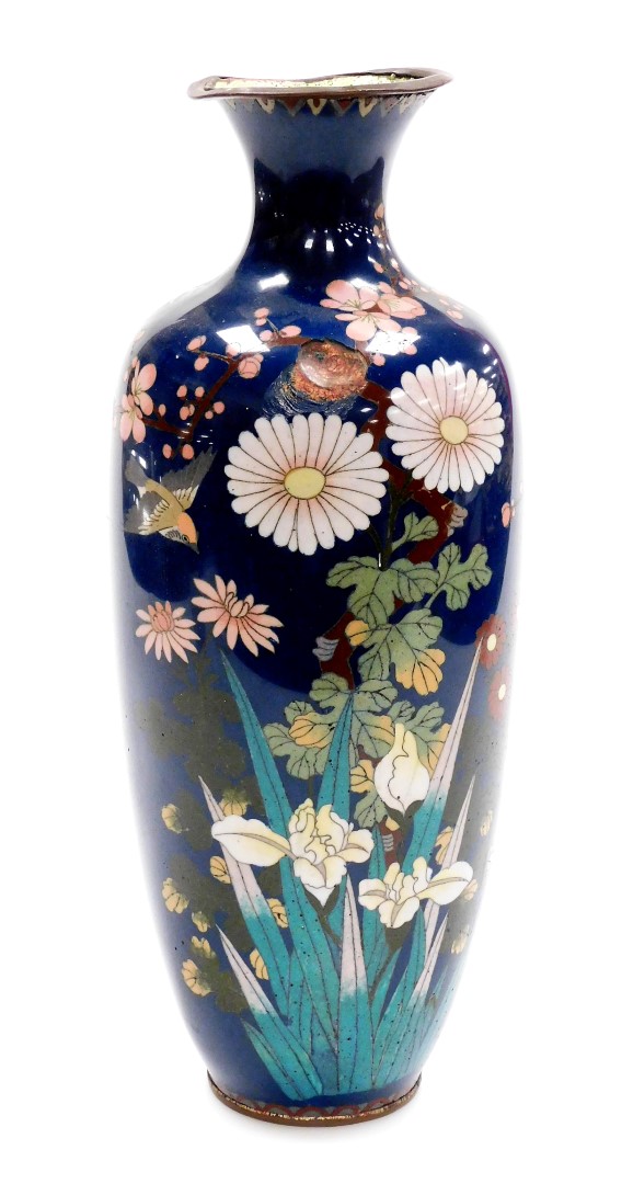 A Meiji period Japanese cloisonne baluster vase, decorated with flowers on a blue ground, 35cm high.