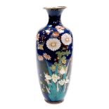 A Meiji period Japanese cloisonne baluster vase, decorated with flowers on a blue ground, 35cm high.