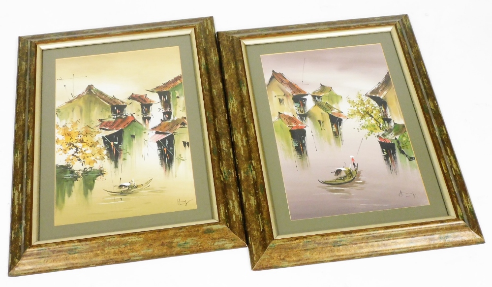 A 20thC Chinese painting on linen depicting waterways with houses, boats and figures, signed 45cm