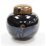 A Ming style Chinese pottery globular ginger vase and cover, glazed in dark blue and brown,