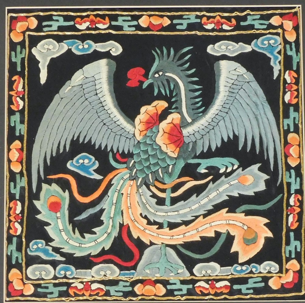 A pair of 20thC Chinese silk embroideries, in the style of rank badges depicting a dragon with - Image 2 of 3