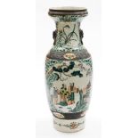 A Chinese crackle glazed baluster vase, decorated in orange and green enamels with sages in grove,