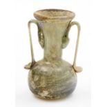 A Roman style glass vase, with trumpet stem and bellied circular body, with elaborate handles, in