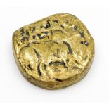 An Indian bronze seal, of tablet form, cast in low relief with a design of characters and figures,