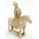 A Chinese Ming terracotta figure of a rider on horseback, with detachable head, 33cm high, 26cm