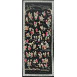 A 20thC Chinese silk embroidery panel depicting children at play on a black ground, 84cm x 32cm.