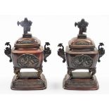 A pair of Japanese bronze incense burners, each with domed lids with Sambaso dancer knops, the