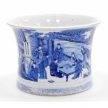 A large Chinese blue and white porcelain brushpot, of waisted form decorated with a continuous scene