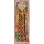 An Indian embroidery wall hanging, in multicoloured abstract panels, with beadwork, sequins and