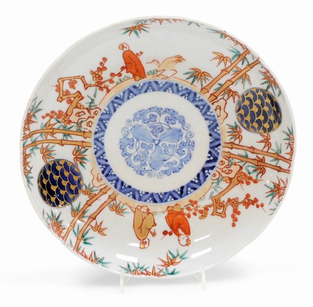 A set of four Japanese Imari porcelain plates, decorated with figures among bamboo and prunus, - Image 8 of 9