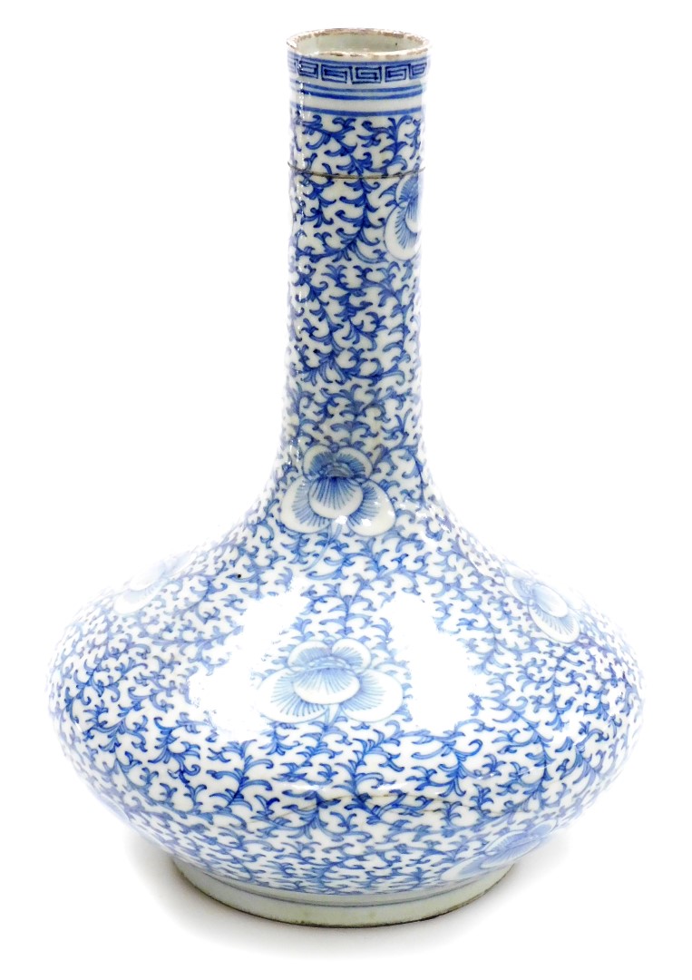 A Chinese porcelain blue and white bottle vase, with slender neck decorated with an all over