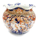 A large Japanese Imari Meiji period jardiniere, the flared rim above a ribbed circular body,