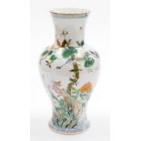 A Chinese porcelain vase, of baluster from decorated with birds, flowers and trees, in orange,