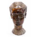 A 20thC African tribal head formed as a lady, with elaborate hair and heavily carved neckline,
